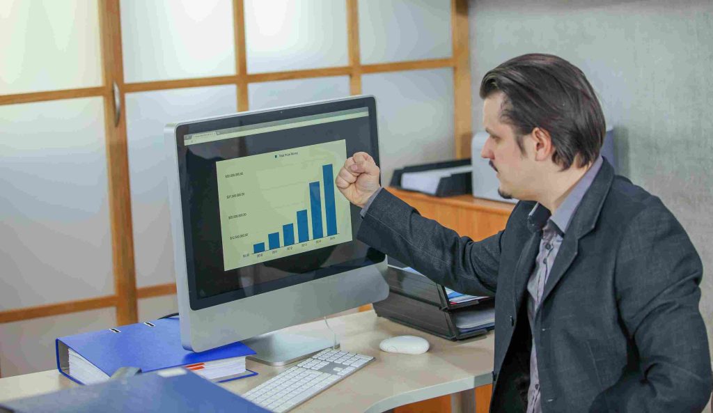 young businessman working from his office concept success