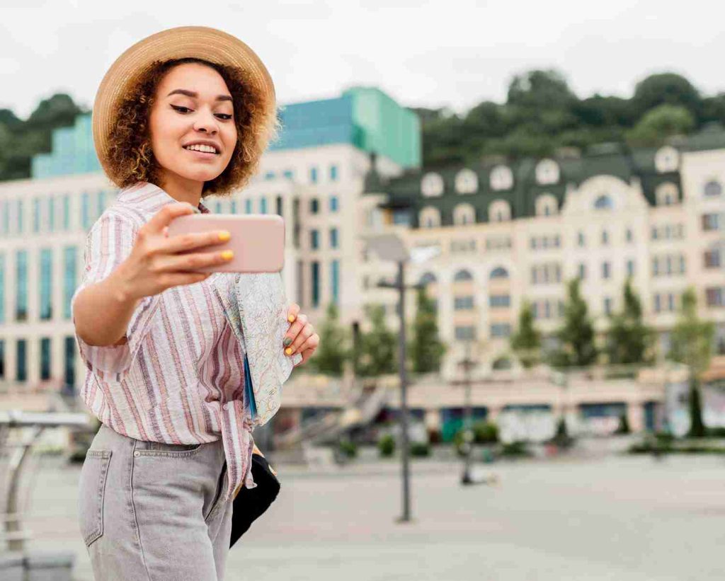 A travel influencer covering stories for her travel diaries and posts