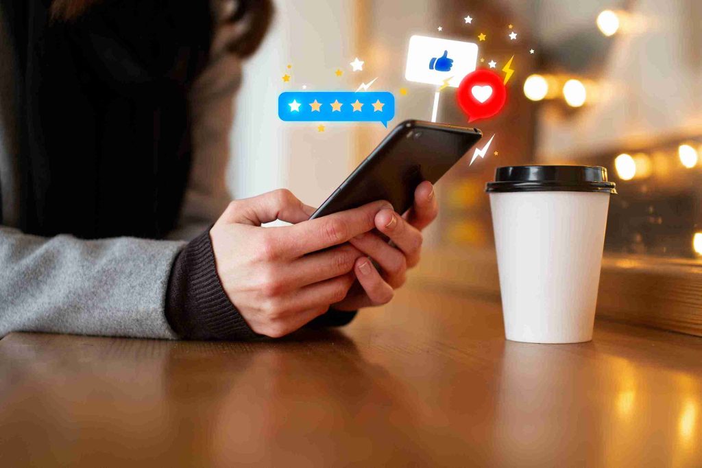A woman using her smartphone to give a high star review to a service.